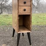 A 31" tall, 9" wide, 18" deep nightstand made of red oak.