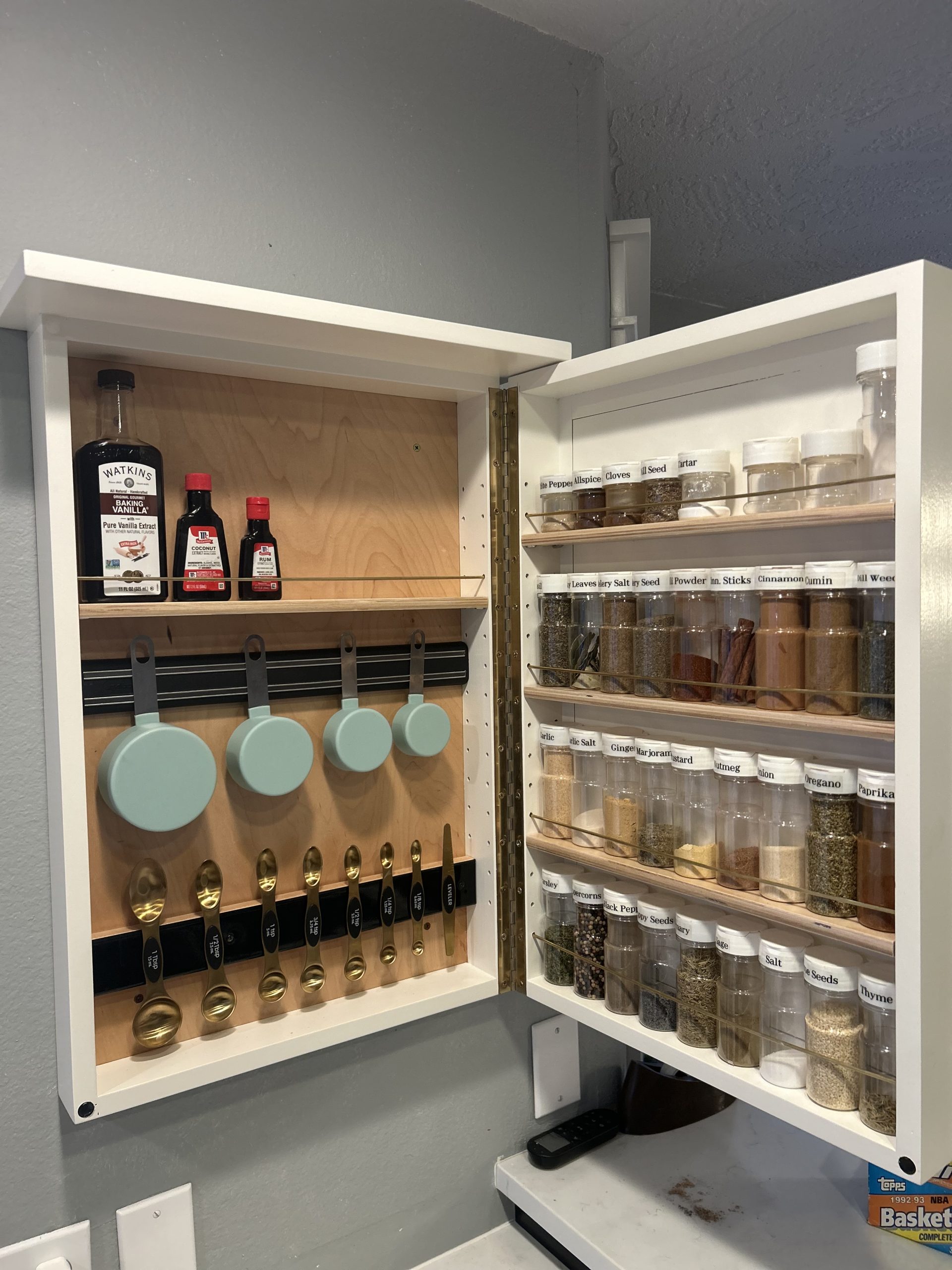 I made a spice cabinet slash measuring cup cabinet slash measuring spoon cabinet